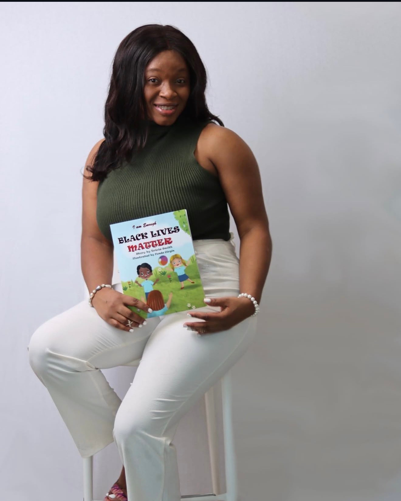 Tricia Smith holding her book Black Lives Matter